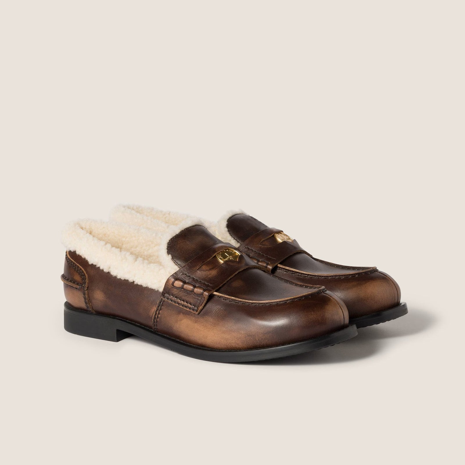Bleached leather and shearling penny loafers
