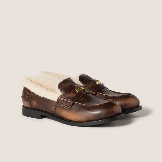 Bleached leather and shearling penny loafers