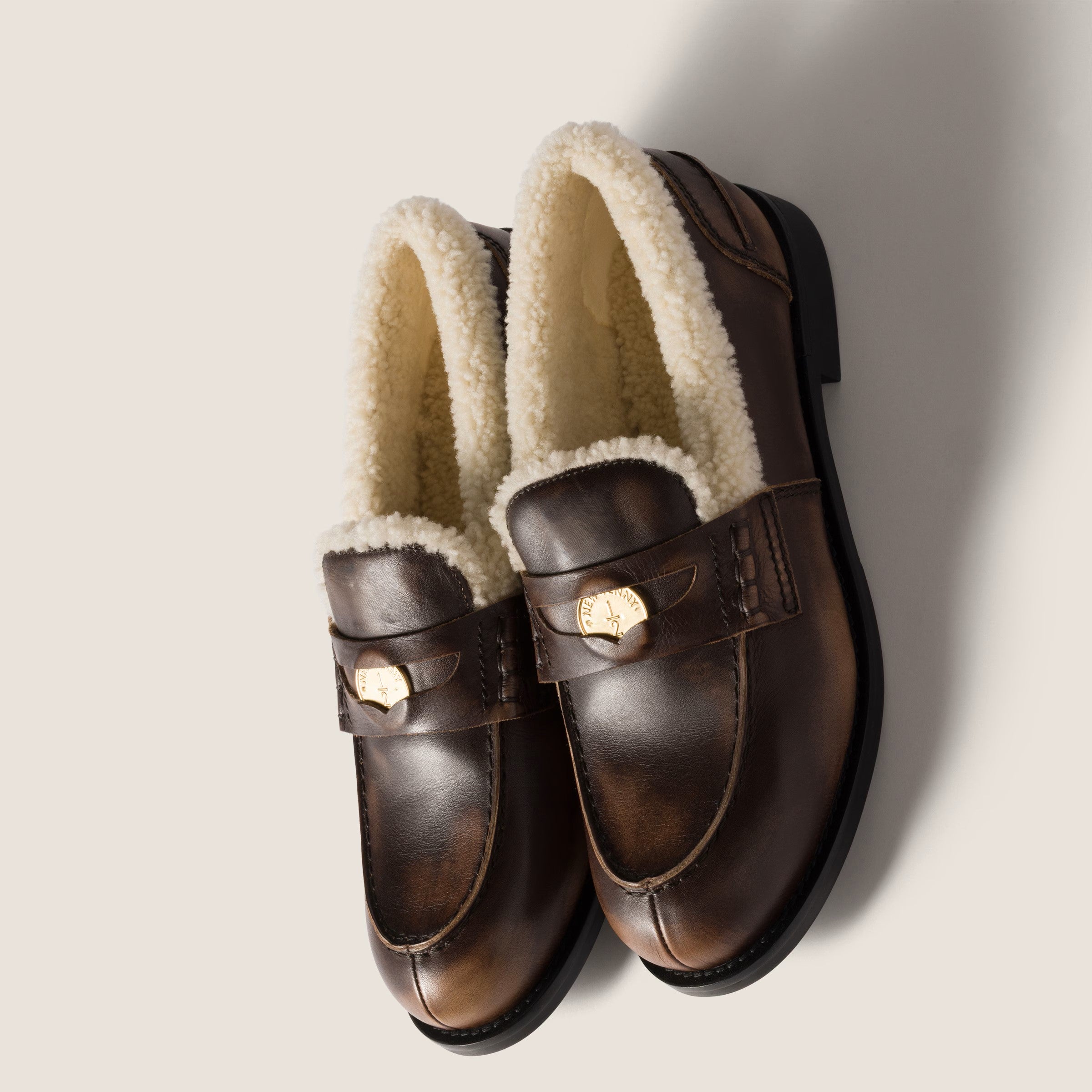 Bleached leather and shearling penny loafers
