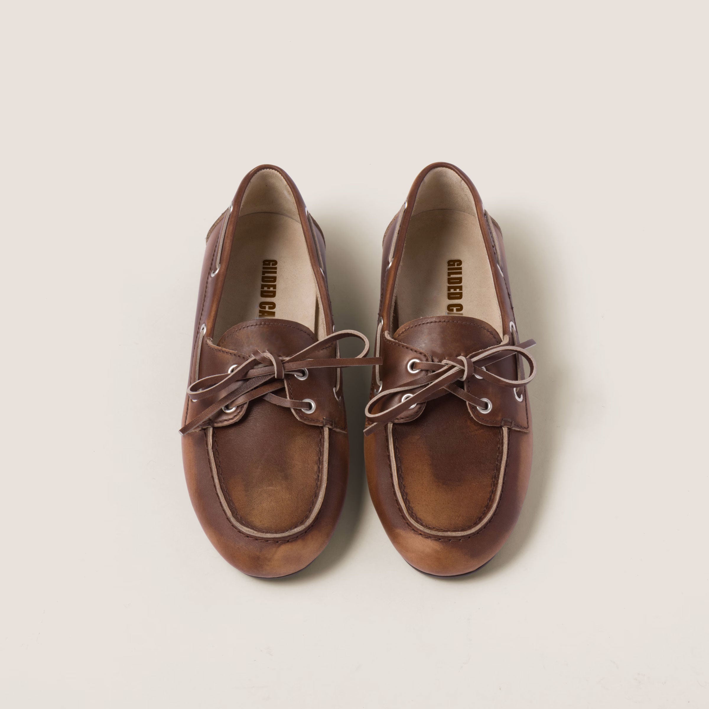 Unlined bleached leather boat shoes