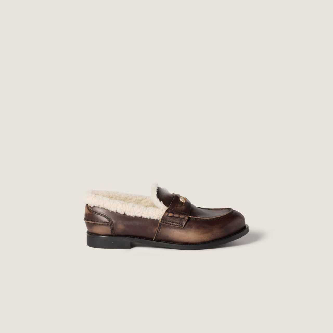 Bleached leather and shearling penny loafers